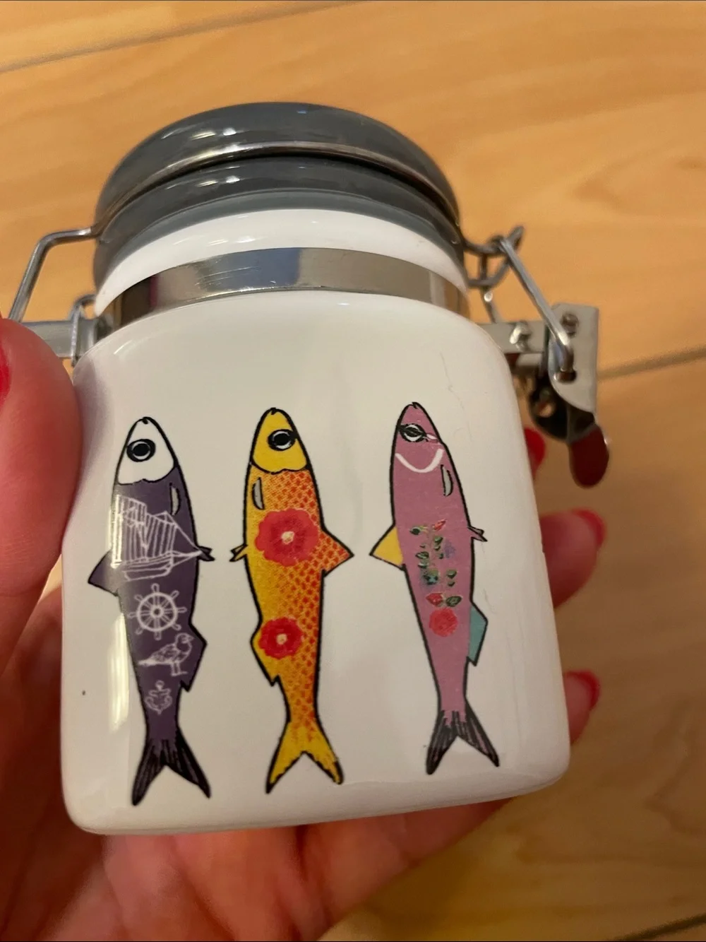 White Ceramic Fish Treat Jar with Colorful Fish Design